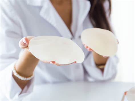 unable to do breast cancer test due to hard implants|can breast implants cause lumps.